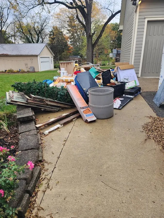 Dumpster being loaded with debris for 30 Yard Dumpster Rental in Falls Church
